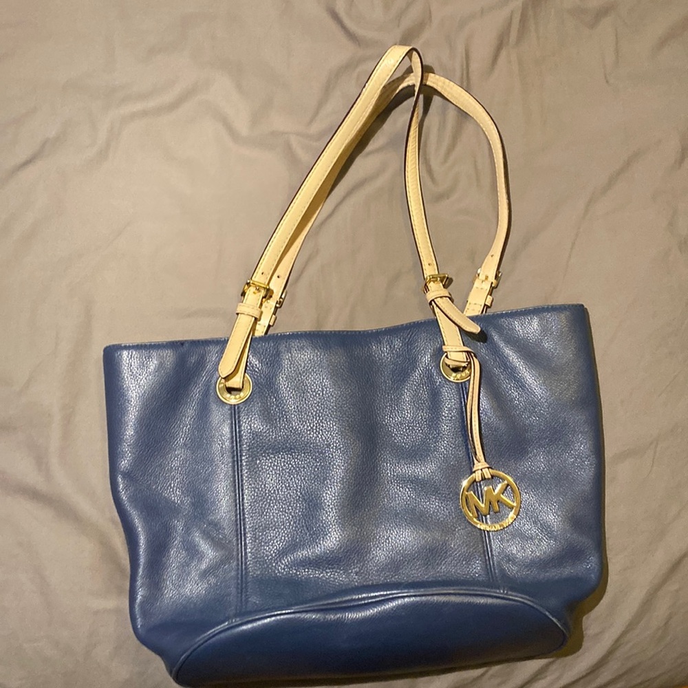 Navy blue and cream soft leather bucket style bag. Authentic Michael Kors.